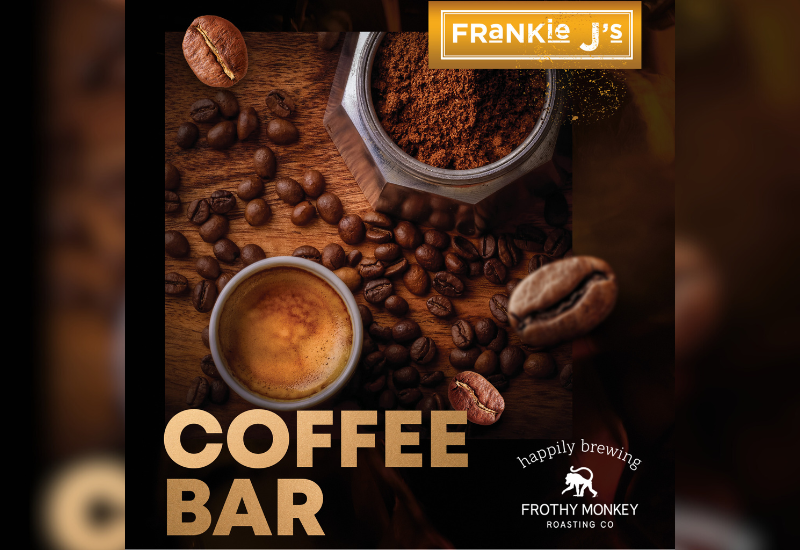Espresso and coffee beans on a wooden surface with "COFFEE BAR" text and Frankie J's branding.